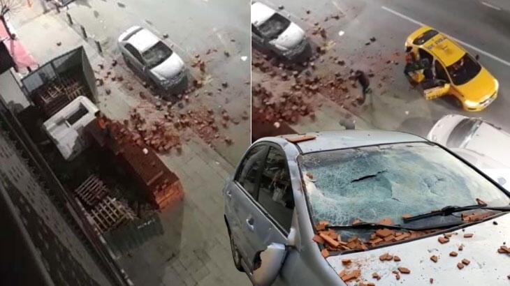 İnşaata giren kadın üzerine çıktığı tuğlaları park halindeki araçlara attı