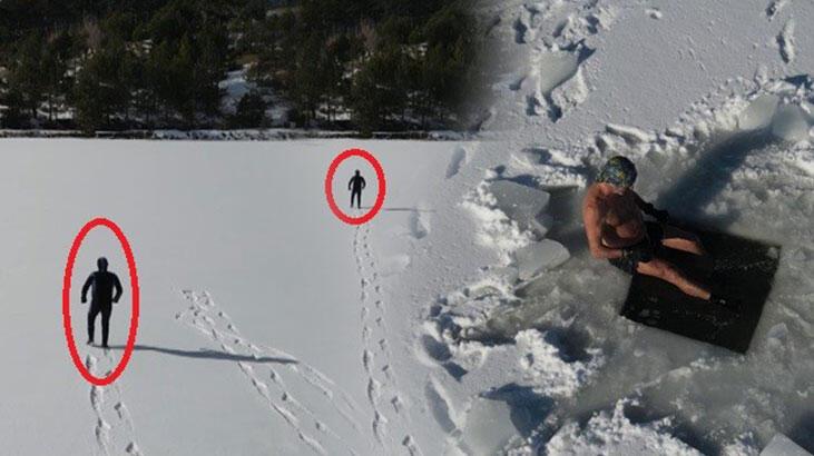Uludağ’ın buz tutan göllerini testere ile kesti! Üzerinde yürüyüp altında yüzüyor
